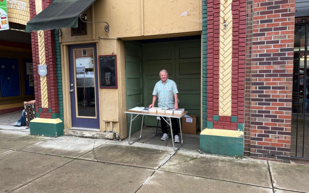 The perils of publishing: Trying to sell books from an ‘alcove’  in the spitting rain